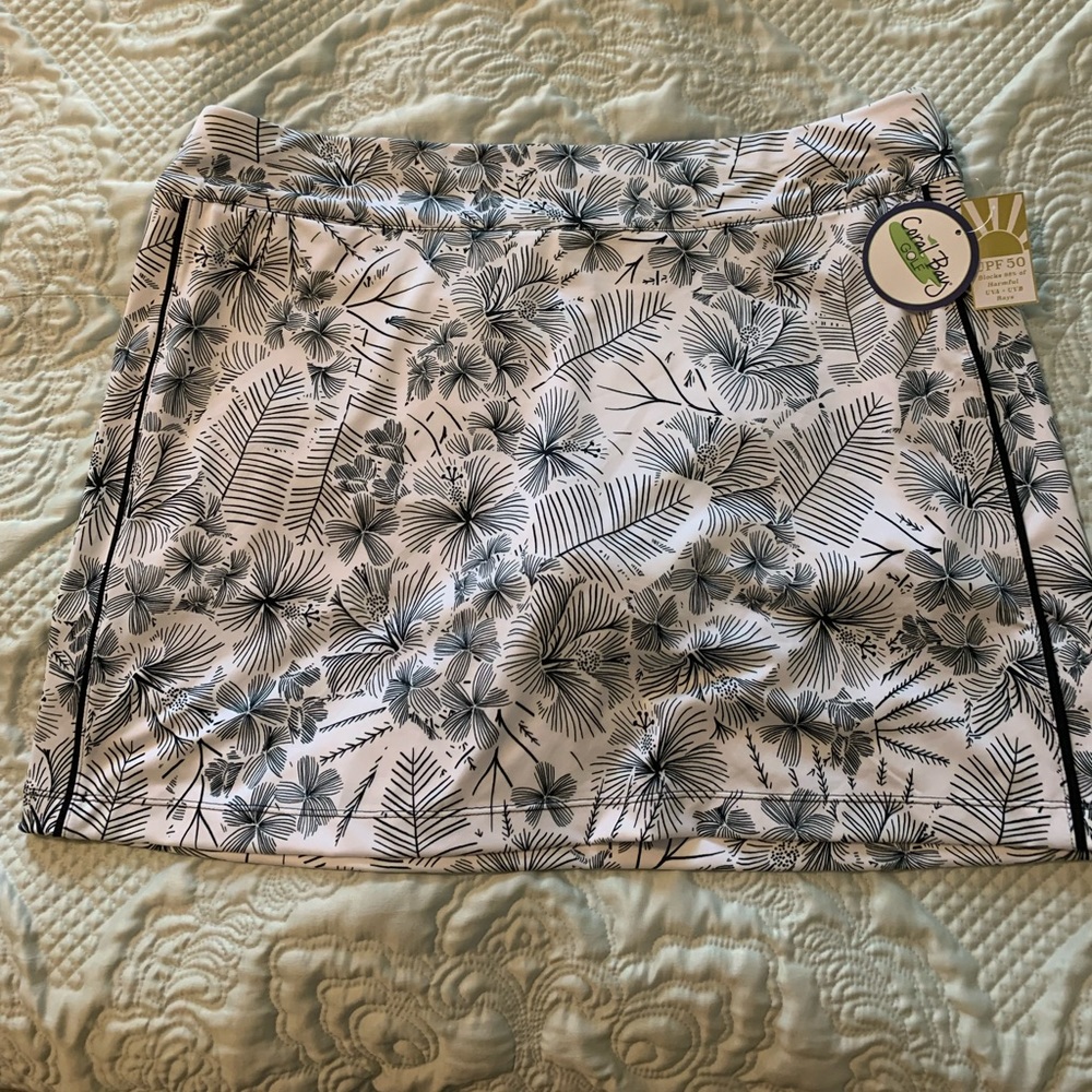 Golf skort. White and very dark green
